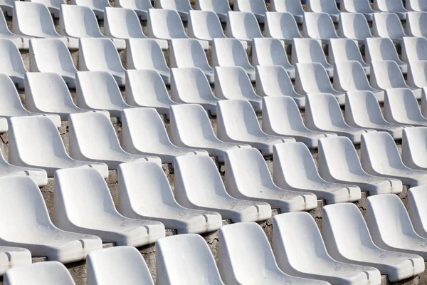 Empty plastic seats on football stadium — Stock Photo, Image