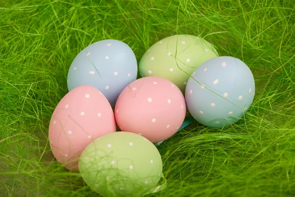 Colorful easter eggs on a green grass — Stock Photo, Image