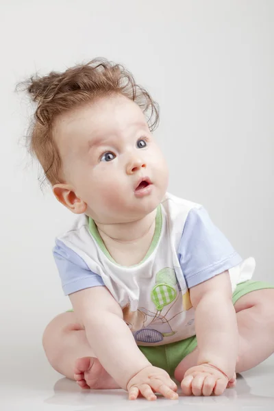 Portrait of cute baby with funny hair — Stock Photo, Image