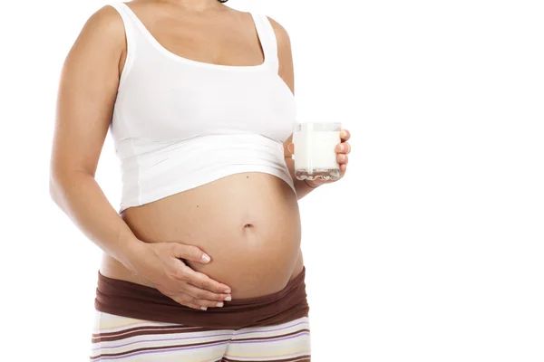 Regnant woman with glass of milk — Stock Photo, Image