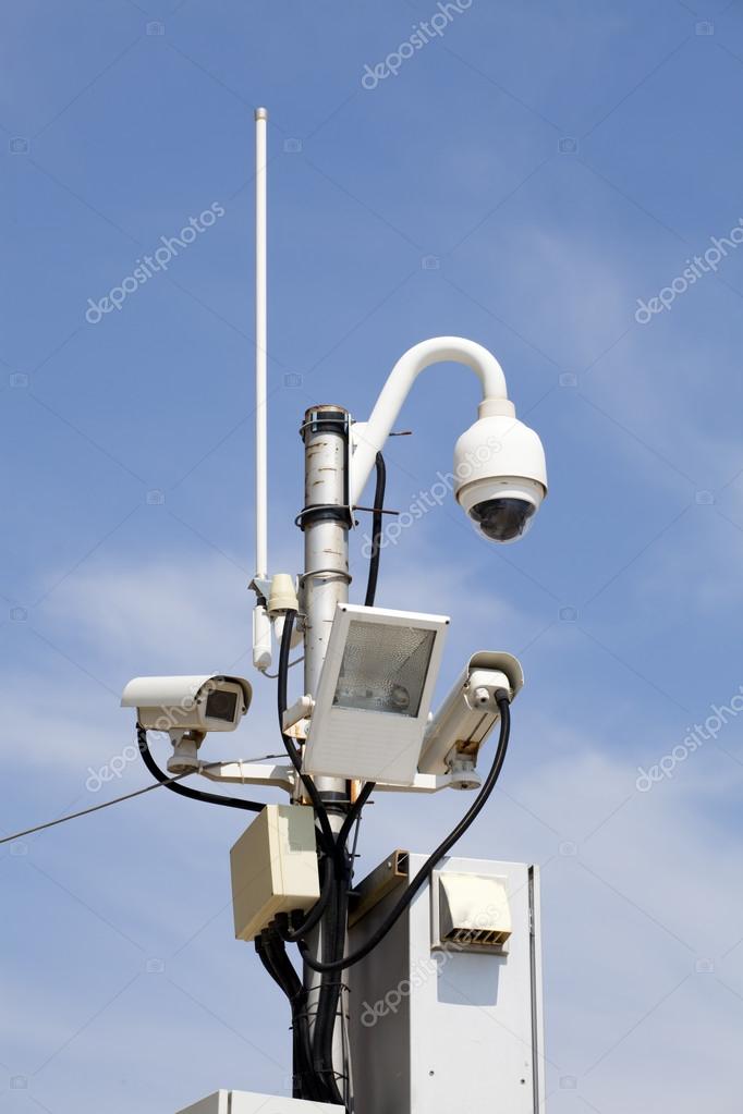 Security cameras over the blue sky — Stock Photo © dechevm 42311233
