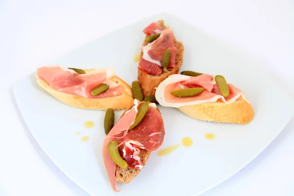 Jamon. Serrano ham, prosciutto served on bread. Tapas food — Stock Photo, Image