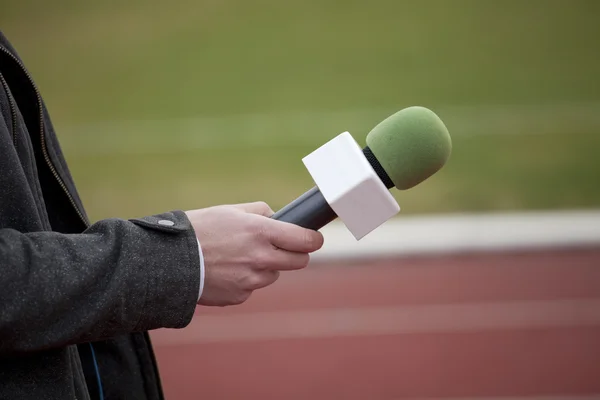 Hand hold microphone for interview — Stock Photo, Image