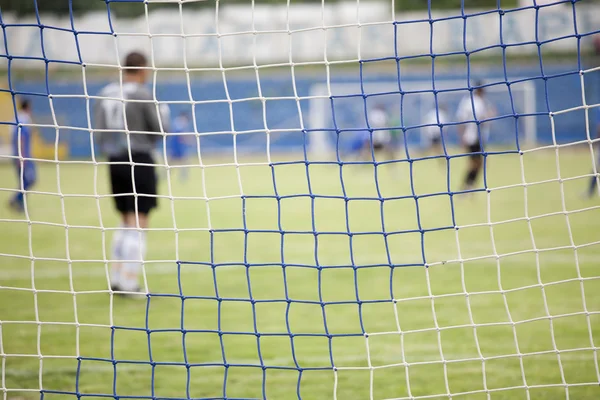 Rete da calcio durante una partita di calcio — Foto Stock