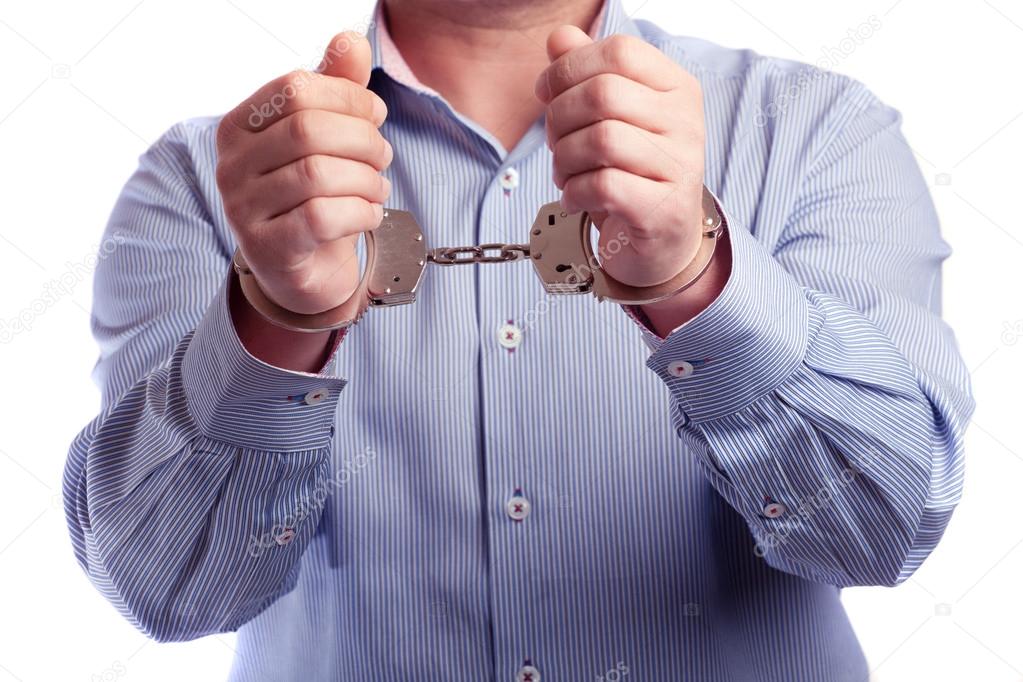 Close up of a man in handcuffs arrested  