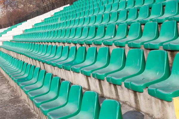 Empty plastic seats on football stadium — Stock Photo, Image