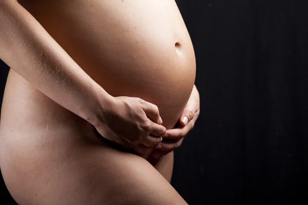 Pregnant woman's belly — Stock Photo, Image