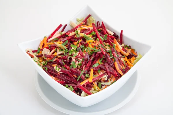 Salad of fresh beets and carrots in white plate — Stock Photo, Image