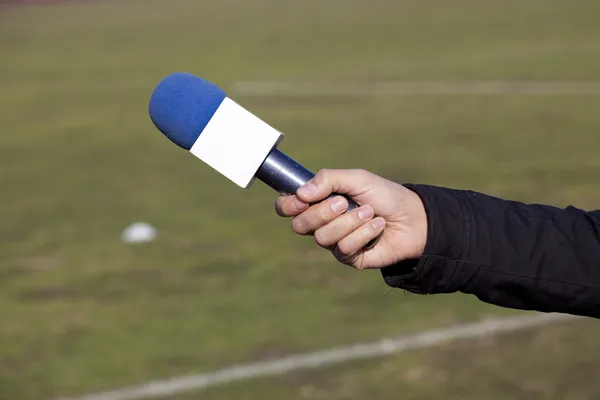 Hand hold microphone for interview — Stock Photo, Image