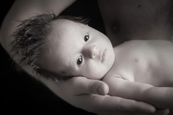 Father holding baby in his hand — Stock Photo, Image