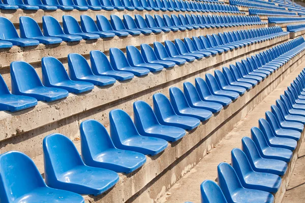 Empty plastic blue seats on football stadium — Stock Photo, Image