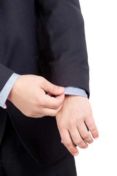 Closeup of a man in suit correcting a sleeve — Stock Photo, Image