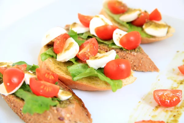 Tapas with mozzarella and  cherry tomatoes — Stock Photo, Image