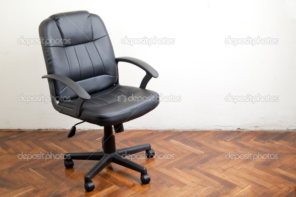 Black leather office chair in room