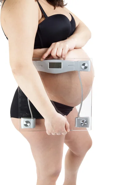 Bauch einer schwangeren Frau hält das Gleichgewicht — Stockfoto