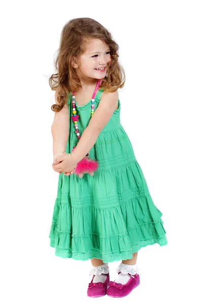 Petite fille mignonne souriante avec robe verte — Photo