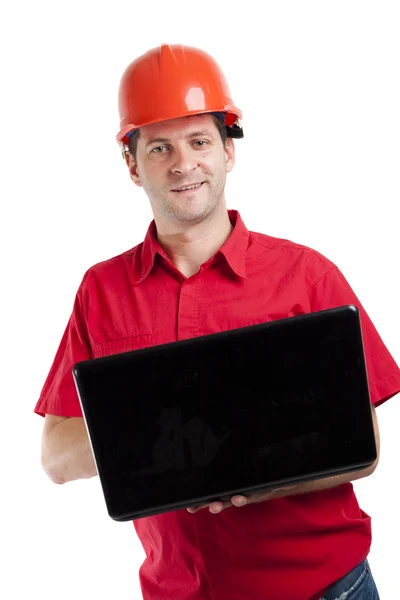 Construction engineer using his laptop computer on the job — Stock Photo, Image