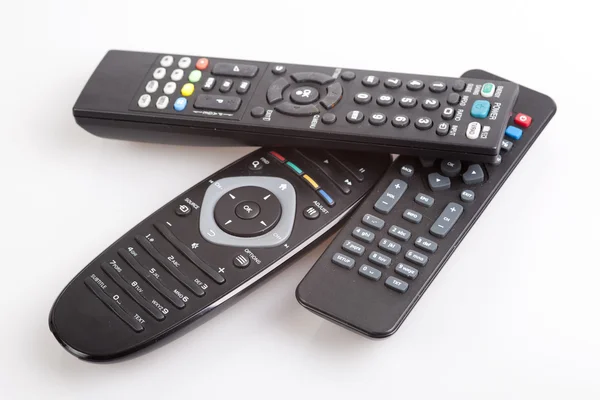 Three remote control devices on white background. — Stock Photo, Image