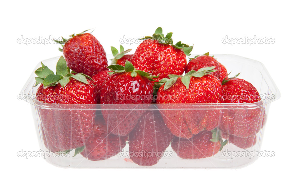 Fresh strawberries in plastic box, isolated on white