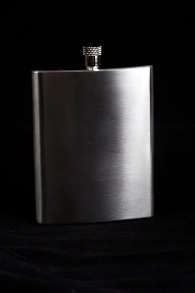 Stainless hip flask on black background — Stock Photo, Image