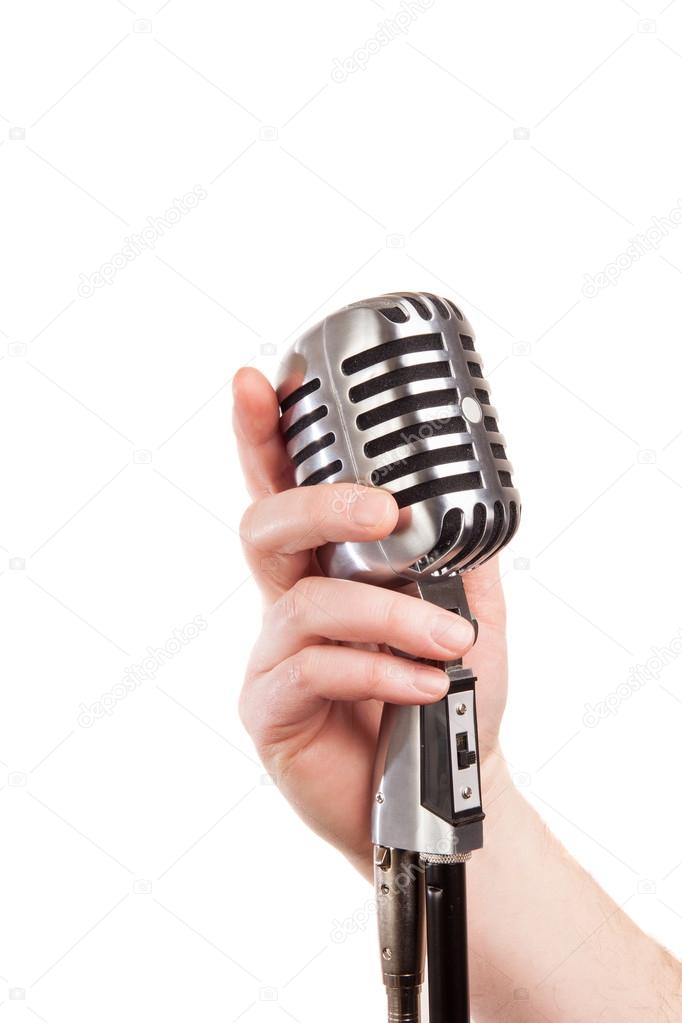  hand holding a retro microphone, isolated on white