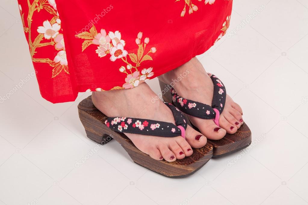 Legs of woman in Japanese kimono style. Geta, Japanese ornamental zori shoes