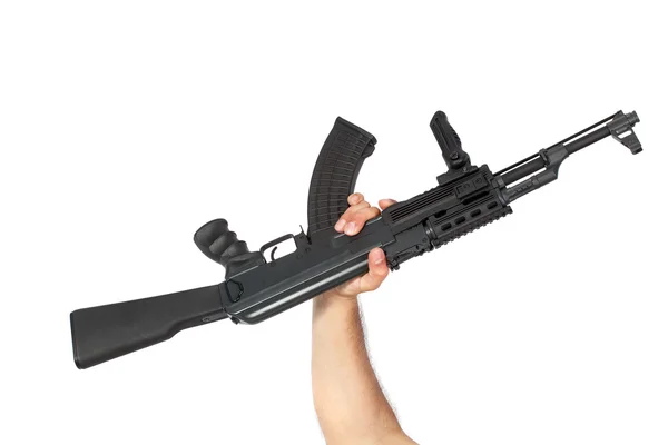 Mão segurando AK-47 metralhadora isolada em branco — Fotografia de Stock
