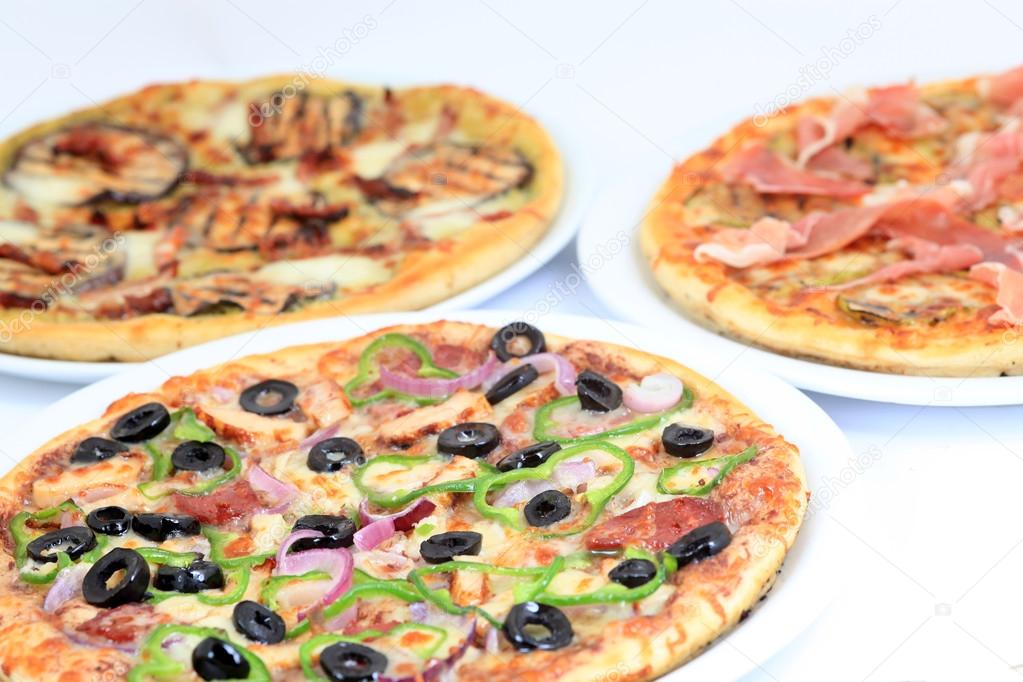 three different kind of pizzas