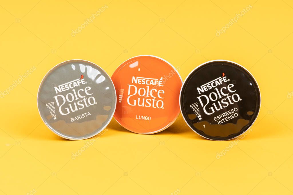 VARNA, BULGARIA - SEPTEMBER 8, 2021: Nescafe Dolce Gusto coffee capsules on yellow background.