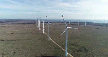 4K aerial view of wind turbine. Windmill for electric power production. Green energy. Renewable energy.