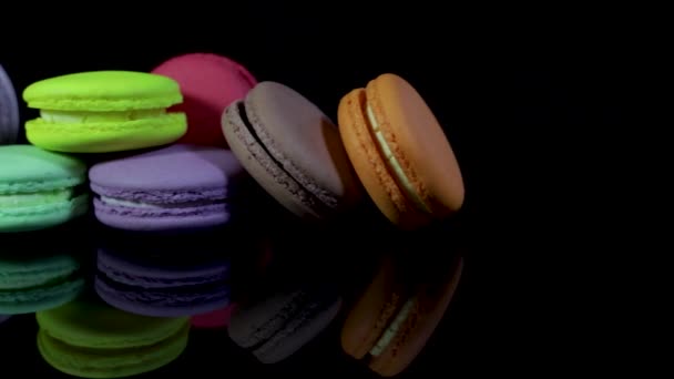 Lots Colorful Macaroons Black Background Reflection Traditional French Dessert — Stock Video