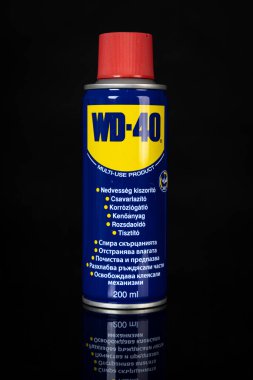 VARNA, BULGARIA - MAY 19, 2022: WD-40 on black background. Multi use product protects metal from rust and corrosion