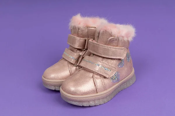 Cute child\'s winter shoes. Pink shoes