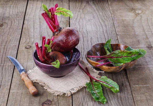 Organic beetroot over rustic wooden background — Stock Photo, Image