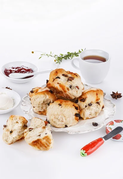 Sconces with afternoon tea items over white background — Stock Photo, Image