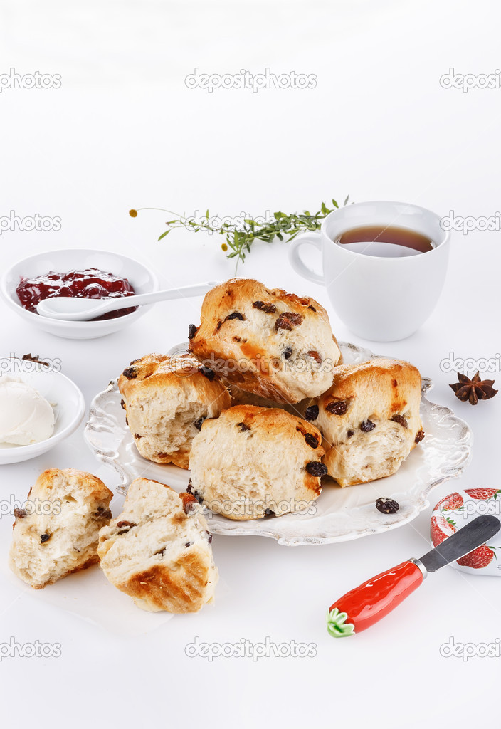 Sconces with afternoon tea items over white background
