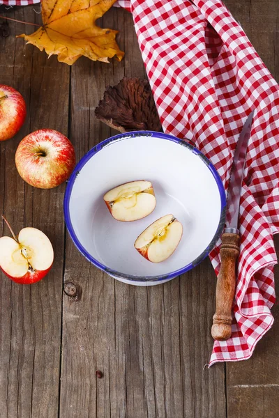 Autumn still life with apples over rustic wooden background — Stock Photo, Image