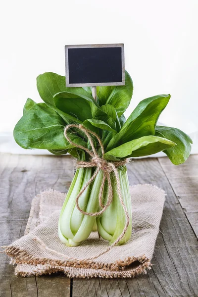 Bock Choy on a rustic wooden background — Stock Photo, Image