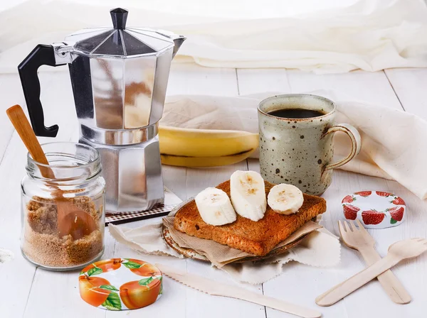 Breakfast with coffee and toast over white wooden background — Stock Photo, Image