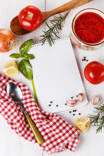 Cooking concept. Recipe book and ingredients for cooking tomato — Stock Image Cooking concept. Recipe book and ingredients for cooking tomato Royalty Free Stock Photos
