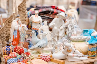 Lviv, Ukraine - 08.01.2022 : Vintage porcelain figurines on flea market. Old soviet figurines from ussr period, collectibles memorabilia. Vintage decorative things on garage sale. Selective focus