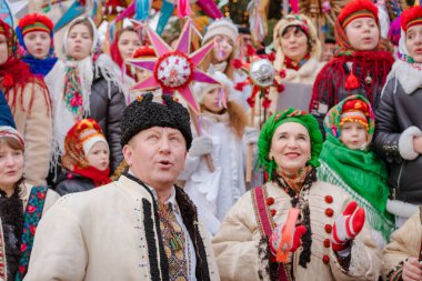 Lviv, Ukraine - January 8, 2022 : The flash of Christmas star festival, traditional Christmas stars festival. Celebration of Orthodox Christmas in Lviv with vertep. Selective focus