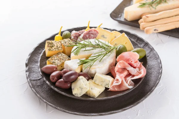 Charcuterie Board Assortment Cheeses Salami Prosciutto Served Olives Black Plate — Stock Photo, Image