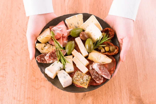 Woman Holding Plate Traditional Italian Appetizer Antipasti Plate Assortment Cheeses — Stock Photo, Image