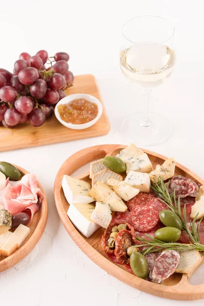 Vertical Composition Antipasti Plate Variety Cheeses Sausages Served Glass Wine — Stock Photo, Image