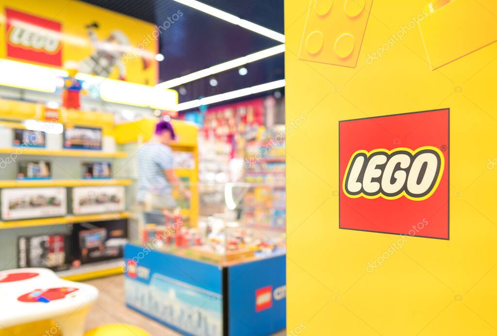 Lviv, Ukraine - May 7, 2022 : Lego department at the biggest toy store Budynok igrashok (Toy's House). Logo at yellow wall. Selective focus