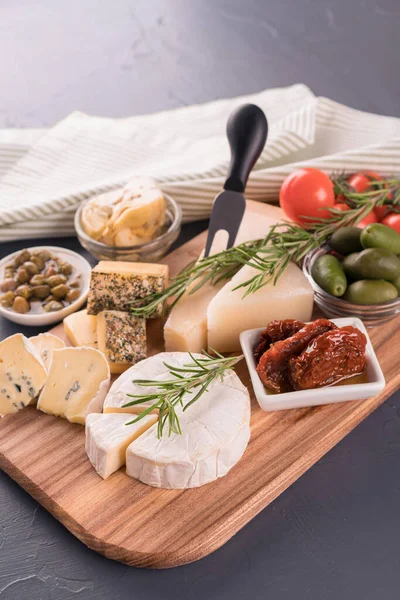 Cheese Board Selection Cheeses Served Olives Tomatoes Herbs Black Table — Stock Photo, Image