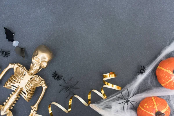 Festive Halloween Composition White Cobweb Spiders Pumpkins Bats Golden Skeleton — Foto de Stock