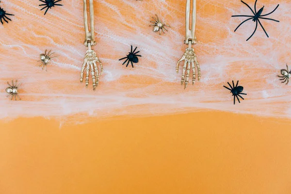 Halloween Background Cobweb Spiders Golden Skeleton Hands Orange Background Copy — Stockfoto