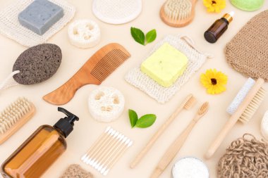 Self-care products and herbal cosmetics for bodycare and skin care. Natural bath accessories bundle with lavender flowers over light background. Eco living concept and home spa